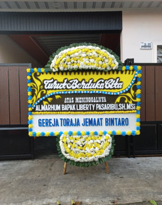 Papan Bunga Duka di Langgeng